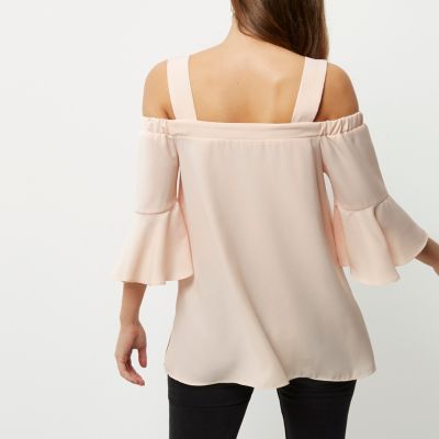Light pink cold shoulder bell sleeve top